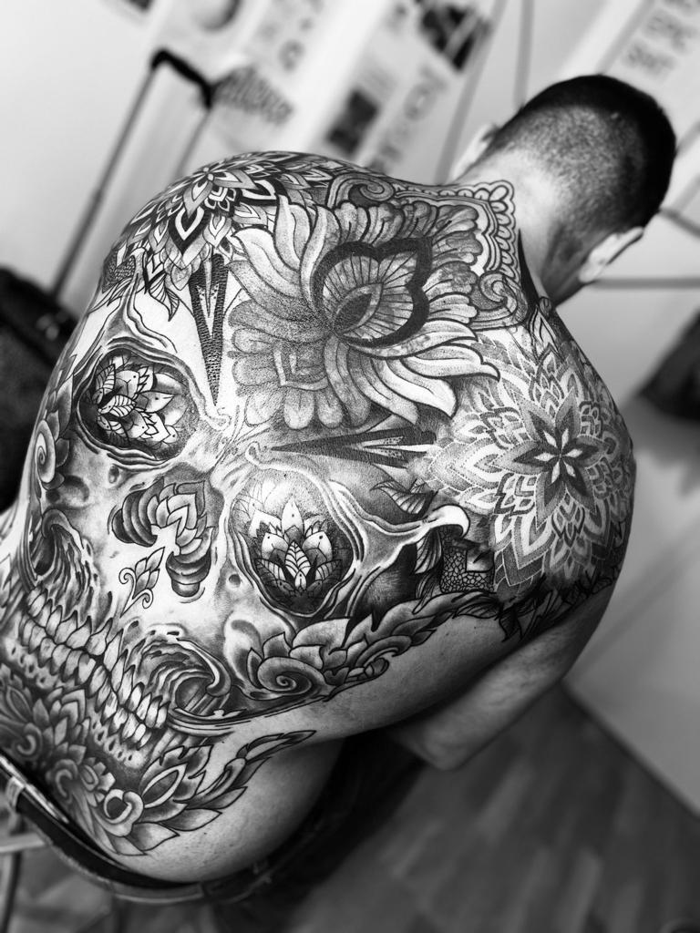Back tattoo skull flower mandala